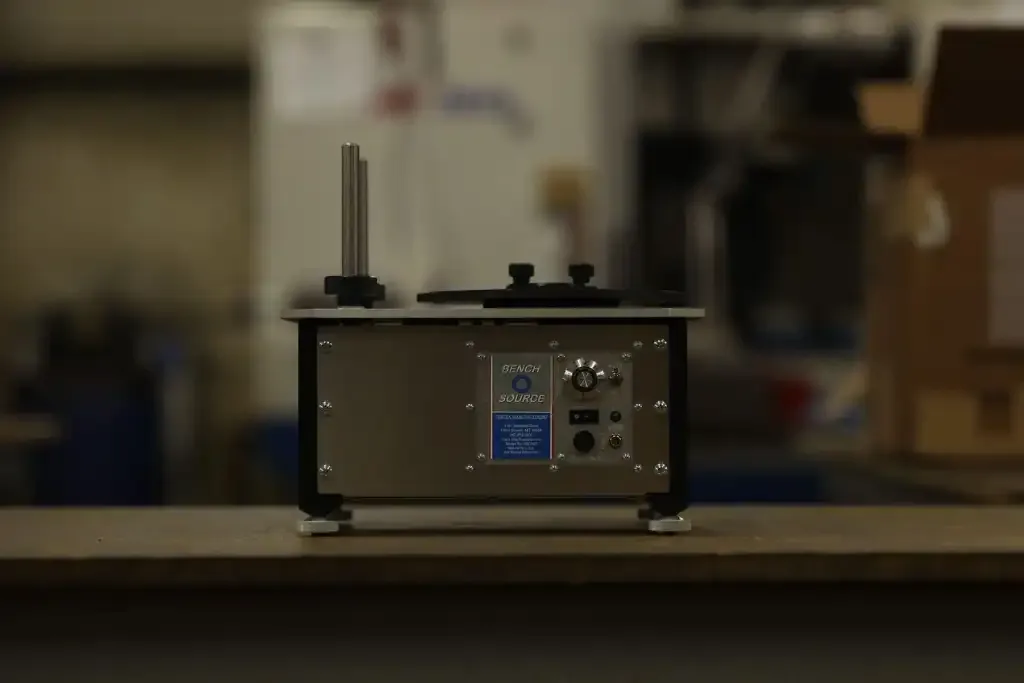 Bench Source case neck annealing machine on a workbench
